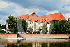 Monuments in WrocÃâaw on the banks of the Oder as seen from the other side on a sunny day